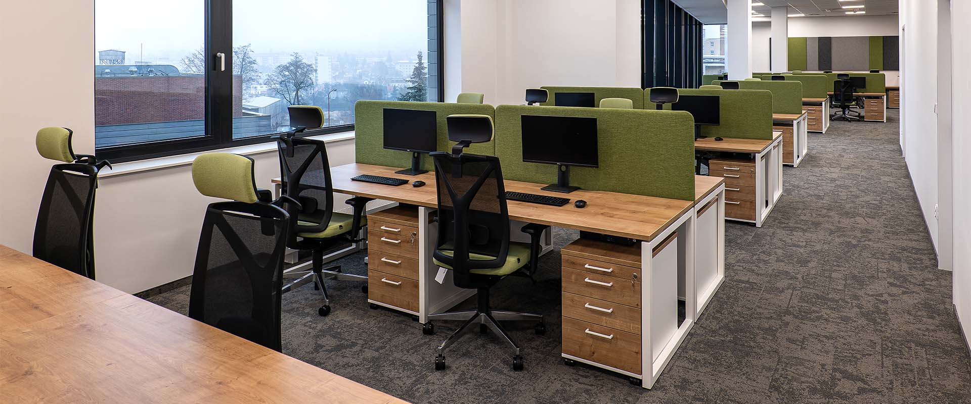 Open plan office with desks and chairs